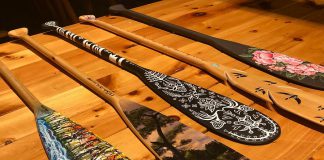 Dr. Roberta Bondar, Canada's first female astronaut, has created and donated a paddle (second from left) for the Campfires & Cocktails fundraiser, which takes place at The Canadian Canoe Museum on May 4, 2019. Also pictured are paddles created (from left to right) by Robert Atyeo, Tia Cavanagh, Randall Knott, and Robyn Jenkins. A total of 14 paddles, as well as cedar-strip canoe constructed by the late Lakefield boat builder Walter Walker, will be auctioned off during the event, with proceeds supporting the museum's educational and public programs. (Photo courtesy of The Canadian Canoe Museum)
