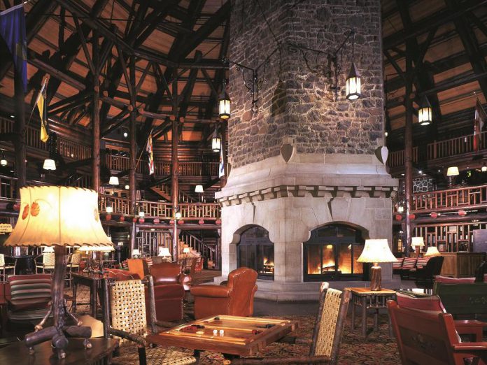 The Quebec Resort Getaway includes a night at Le Château Montebello, the largest log building in the world. Pictured is the hotel lobby, which features a three-storey atrium built around a massive stone fireplace with a 20-metre chimney. (Photo: Fairmont Le Château Montebello)