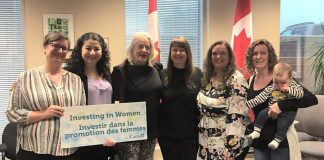 Staff and board members of the Elizabeth Fry Society of Peterborough pose with Maryam Monsef, Minister of International Development and Minister for Women and Gender Equality and Minister of International Development and Minister for Women and Gender Equality and Peterborough—Kawartha MP, on April 26, 2019 following an announcement of federal funding.. The organization is one of six women's oroganizations in Ontario that are receiving funding under the Government of Canada's Capacity-building Fund. From left to right: board chair Frances Wilbur, Minister Maryam Monsef, board member Marlis Lindsay, board treasurer Mary Goddard, executive director Debbie Carriere, and board member Emily Rashotte with Clive. (Photo: Elizabeth Fry Society of Peterborough / Facebook)