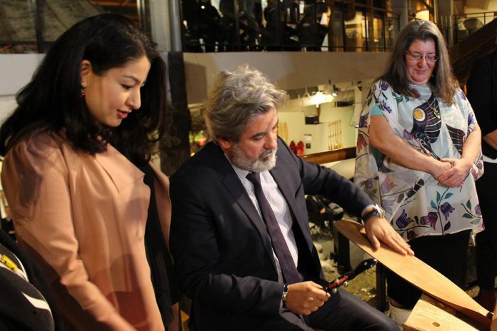 Minister of Canadian Heritage and Multiculturalism Pablo Rodriguez tries his hand at paddle carving at The Canadian Canoe Museum on Monaghan Road in Peterborough on April 1, 2019, as Peterborough-Kawartha MP Maryam Monsef (left) looks on. The Government of Canada announced a $10 million investment from the Canada Cultural Spaces Fund for the contruction of a new museum facility. (Photo courtesy of The Canadian Canoe Museum)