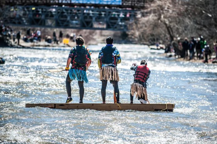 It's not a dock, it's a boat! A team floats down the Ganaraska River during 2018's 'Float Your Fanny Down the Ganny'. The 10-kilometre "Crazy Craft" race begins at 10 a.m. on Saturday, April 13, 2019 at the Sylvan Glen Conservation Area.  (Photo: Walton St. Photography)