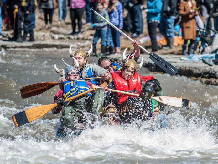 A team paddling their makeshift watercraft battles the current of the Ganaraska River during last year's 'Float Your Fanny Down the Ganny' race. This year's race is scheduled for Saturday, April 13, 2019. (Photo: Walton St. Photography)