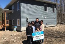 Members of the Jacobs family in front of their new home at 76 Quinquish Road in Curve Lake on April 28, 2019. The home was made possible through a partnership between Curve Lake First Nation and Habitat for Humanity Peterborough & Kawartha Region. (Photo courtesy of Habitat for Humanity Peterborough & Kawartha Region)