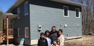Members of the Jacobs family in front of their new home at 76 Quinquish Road in Curve Lake on April 28, 2019. The home was made possible through a partnership between Curve Lake First Nation and Habitat for Humanity Peterborough & Kawartha Region. (Photo courtesy of Habitat for Humanity Peterborough & Kawartha Region)