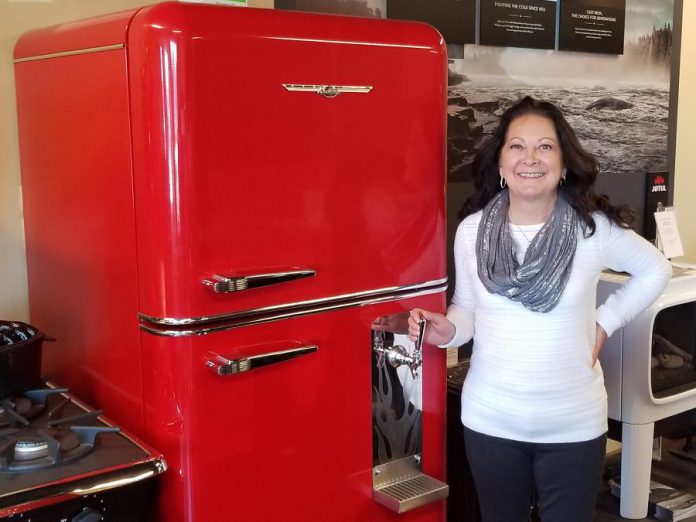 Owner of The Original Flame, Michele Kadwell-Chalmers, can assist anyone looking to add an instant dose of vintage glam to their home or business with the most enduringly popular designs dating back decades, like this red Northstar fridge with a draft beer dispenser in the door. (Photo courtesy of The Original Flame)