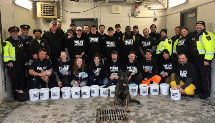 Members of the Peterborough Police Service Auxiliary Unit, Special Constables, Torch Run Team members, Canine Unit Constable Cowie and Police Service Dog Isaac, civilians, Fleming College students, and family members helped to raise $32,000 in donations during the annual Easter Tolls for Special Olympics on April 20, 2019. (Photo courtesy of Peterborough Police Service)