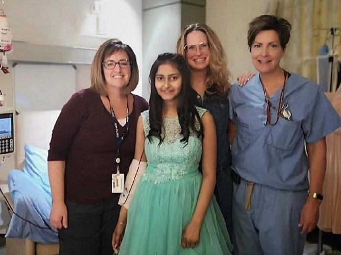 Kristey (second from left) is a 13-year-old girl currently receiving treatment at Peterborough Regional Health Centre, which has made it challenging for her to go shopping for a dress for her Grade 8 gradulation. Staff of the Pediatric Outpatient Clinic including RN Shay Cannon (left) contacted Shelby Watt (second from right), owner of Save Our Soles in downtown Peterborough, to ask if she could help. (Photo: Peterborough Regional Health Centre / @prhc1 Instagram)
