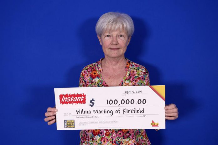 Wilma Marling of Kirkfield with her $100,000 prize. (Photo courtesy of OLG)