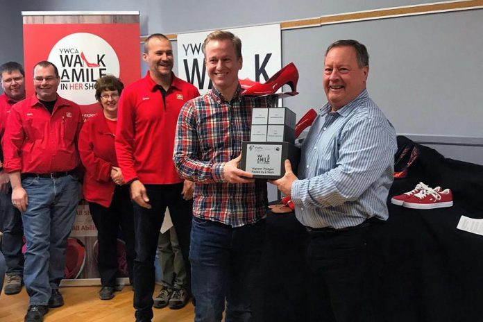 Craig and Tom Mortlock of Mortlock Construction with their awards for top individual and team fundraisers for the 2018 YWCA Walk a Mile in Her Shoes, at the April 4, 2019 launch of the 2019 event. (Photo courtesy of YWCA Peterborough Haliburton)