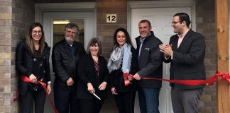 Officials at the grand opening of Bond by the River on May 1, 2019. The affordable housing project in Lindsay features 12 three-bedroom townhouse units at a cost of $997 a month, 20 per cent less than the average market price. From left to right: Erika Robson for MPP Laurie Scott, KLH Housing vice chair Pat Dunn, KLH Housing CEO Hope Lee, affordable housing consultant Nadia Venafro, City of Kawartha Lakes mayor Andy Letham, and Dylan Robichaud for MP Jamie Schmale. (Photo courtesy of City of Kawartha Lakes)