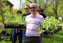 Customers at last year's GreenUP Ecology Park Plant Sale show off their plant purchases. This year, this annual fundraiser for Ecology Park will be held on Saturday, May 18th from 10 a.m. to 4 p.m. (Photo: Karen Halley)