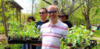 Customers at last year's GreenUP Ecology Park Plant Sale show off their plant purchases. This year, this annual fundraiser for Ecology Park will be held on Saturday, May 18th from 10 a.m. to 4 p.m. (Photo: Karen Halley)