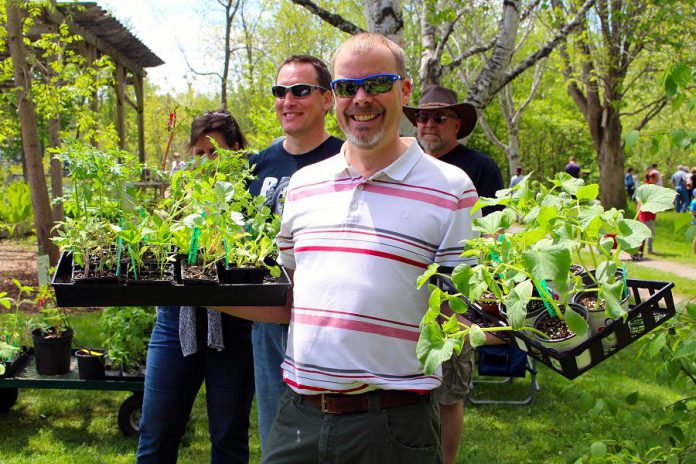 Customers at last year's GreenUP Ecology Park Plant Sale show off their plant purchases. This year, this annual fundraiser for Ecology Park will be held on Saturday, May 18th from 10 a.m. to 4 p.m. (Photo: Karen Halley)