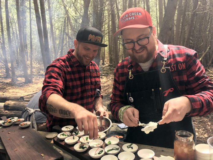 Chefs Eric Boyar from SixThirtyNine in Woodstock and Tyler Scott from Rare Grill House in Peterborough preparing their rainbow trout dish for the Terroir Symposium's Rural Retreat at South Pond Farms in Pontypool on May 7, 2019. (Photo: Eva Fisher / kawarthaNOW.com)