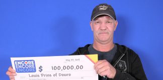 Louis Prins picking up his $100,000 cheque at the OLG Prize Centre in Toronto. He won the prize by matched six of the seven Encore numbers in exact order in the May 17, 2019 Lotto Max draw. (Photo: OLG)