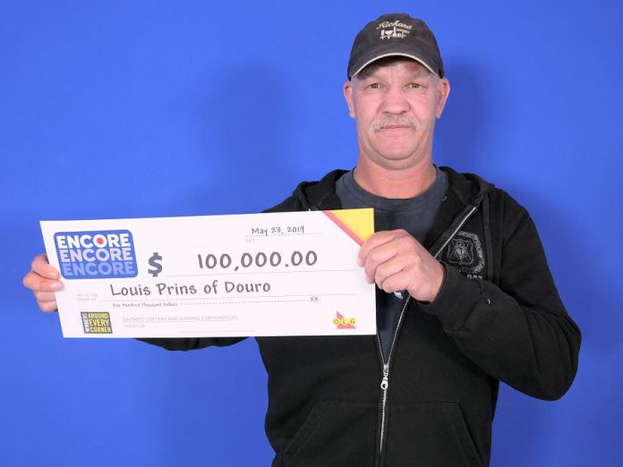 Louis Prins picking up his $100,000 cheque at the OLG Prize Centre in Toronto. He won the prize by matched six of the seven Encore numbers in exact order in the May 17, 2019 Lotto Max draw. (Photo: OLG)