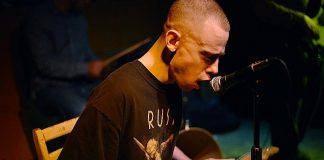 Toronto blues musician and singer-songwriter Mike Nagoda, who self-identifies as LGBT and disabled, performs at the Black Horse Pub in downtown Peterborough on Wednesday, June 5th. Born with cerebral palsy, Mike struggled to play guitar in the conventional manner until the late legendary Toronto bluesman Brian Cober taught Mike how to play "double slide" guitar. (Photo: Mike Nagoda / Facebook)