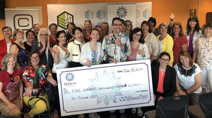 Some of the members of 100 Women Peterborough with representatives from Five Counties Children's Centre, including 15-year-old client Rebecca Jordan and board chair Adam White (both holding the cheque). The non-profit organization that provides therapy services for children will receive more than $10,000 from the group. (Photo courtesy of 100 Women Peterborough)
