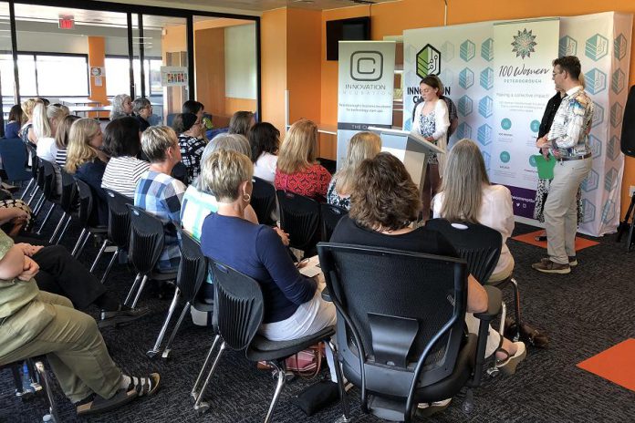 Rebecca Jordan, a  15-year-old client of  Five Counties Children's Centre, speaks to the 100 Women Peterborough group as the centre's board chair Adam White and CEO Diane Pick look on. (Photo courtesy of 100 Women Peterborough)