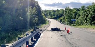 A motorcycle has been destroyed by fire and the driver is in hospital with life-threatening injuries following an accident on Highway 118 in Highlands East on June 16, 2019. A passenger also suffered injuries. (Photo: Bancroft OPP)