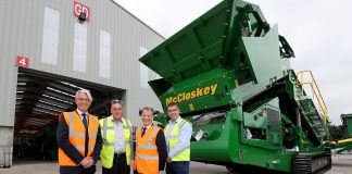 Peterborough-based McCloskey International, which employs around 900 people in Canada, the U.S.A., and Northern Ireland, has been acquired by Finnish industrial machinery company Metso. Pictured are McCloskey International founder, president, and CEO Paschal McCloskey (second from left) and Ian Lough of McCloskey International (far right), along with Mark Nodder and Jeremy Fitch of Invest Northern Ireland at Granville Industrial Estate in County Tyrone in Northern Ireland. (Photo: McCloskey International)