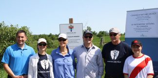 Kawartha Land Trust (KLT) has received $215,000 in funding from the Canadian government's Canada Nature Fund to support the continued protection of the Cation Wildlife Preserve near Coboconk. Peterborough-Kawartha MP Maryam Monsef announced the funding during the grand opening of the preserve on June 22, 2019. Pictured (left to right): Haliburton-Kawartha Lakes-Brock MP Jamie Schmale, KLT development manager Tara King, land donor Sharon Cation, KLT executive director John Kintare, land donor Dave Cation, and MP Monsef. (Photo: Office of Maryam Monsef)