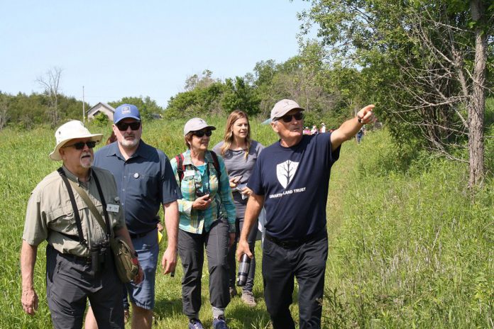 Land donor Dave Cation participates in a guided walking tour during the grand opening of the Cation Wildlife Preserve near Coboconk  on June 22, 2019. The preserve includes marked trails for passive recreational use by the public, including hiking, snowshoeing, and cross-country skiing. (Photo: Office of Maryam Monsef)