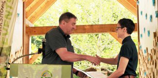 Peterborough—Kawartha MPP Dave Smith presents a certificate to GreenUP executive director Brianna Salmon at an event held at Ecology Park on June 25, 2019, recognizing a $24,900 capital grant provided to GreenUP by the Ontario Trillium Foundation to install a low-water irrigation system at the park. Smith has been appointed parliamentary assistant to the Minister of Energy, Northern Development and Mines and Minister of Indigenous Affairs. (Photo: GreenUP)
