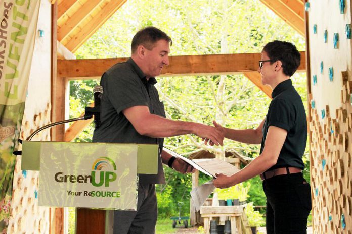 Peterborough—Kawartha MPP Dave Smith presents a certificate to GreenUP executive director Brianna Salmon at an event held at Ecology Park on June 25, 2019, recognizing a $24,900 capital grant provided to GreenUP by the Ontario Trillium Foundation to install a low-water irrigation system at the park. Smith has been appointed parliamentary assistant to the Minister of Energy, Northern Development and Mines and Minister of Indigenous Affairs. (Photo: GreenUP)