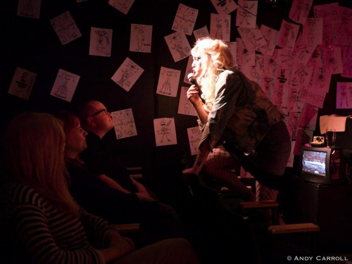 kawarthaNOW Theatre reviewer Sam Tweedle gets up close and personal with  Hedwig (Conner Clarkin) during a preview performance.  (Photo: Andy Carroll)