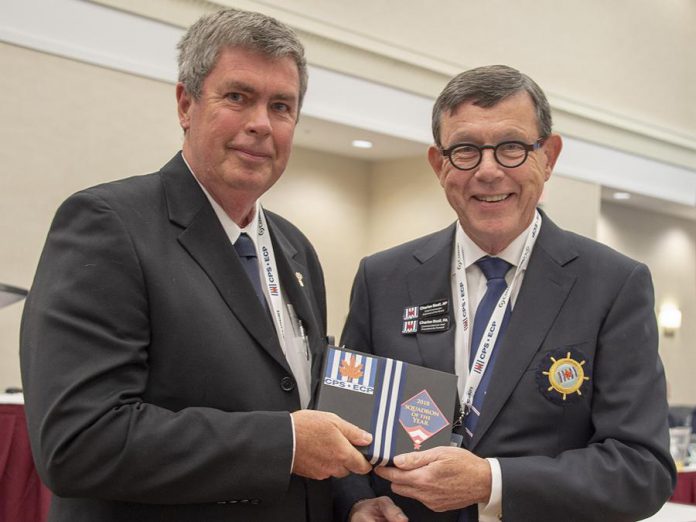 Peterborough Power and Sail Squadron commander Nick Cliteur (left) accepts the Squadron of the Year award from CPS-ECP Chief Commander Chuck Beal in 2018. Cmdr. Beal attended the squadron's 60th annivesrary celebration on June 7, 2019 at the Marshland Centre in Lakefield. (Photo: Don Butt)