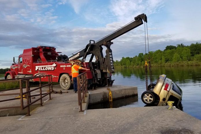 A car is removed from the Trent Severn Waterway near Brighton after two unidentified bodies were discovered in the submerged vehicle on June 17, 2019. (Photo: @OPP_CR / Twitter)