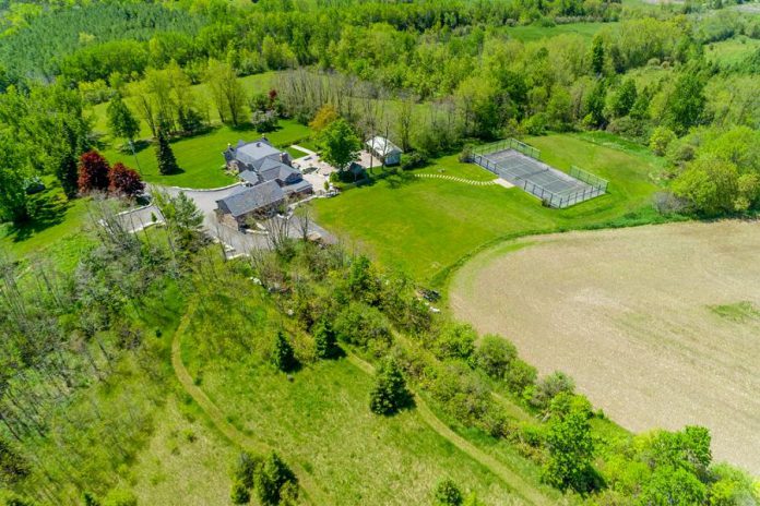 The land where the property resides is a mix of forest and field, with a small pond feeding an irrigation system, and is adjacent to the Trans Canada Trail.