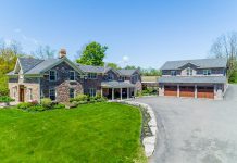 Located on a 100-acre private rural property on the west edge of Peterborough, 124 Lily Lake Road features a stunning stone villa with 6,200 square feet of luxurious living space, along with an outdoor area with a patio, deck, heated in-ground pool, tennis court, and a three-car garage.