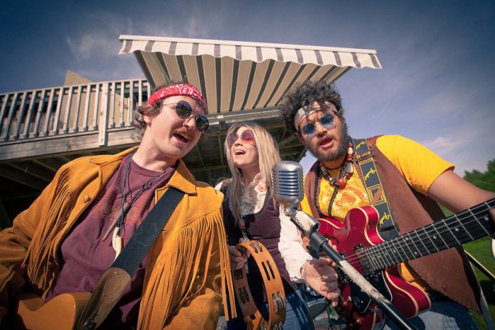 In Beau Dixon's "Bloom: A Rock 'n' Roll Fable", Owen Stahn (left) is Neph Burnstall and Eli Tanner (right) is Griffin Clark, two childhood friends who grow up to form the 1960s Canadian rock 'n' roll band The Spruce Street Ramblers, which rises to fame only after Tess Wilson (played by Kate Suhr, centre) joins the band. Directed by Kim Blackwell, the play runs every Tuesday to Saturday at 4th Line Theatre in Millbrook until July 27, 2019. (Photo: Wayne Eardley / Brookside Studio)