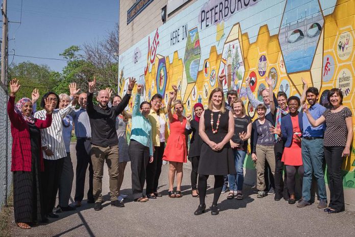 New Canadians Centre executive director Hajni Hõs (front) with her team from the New Canadians Centre. (Photo: Heather Doughty / Inspire: The Women's Portrait Project)