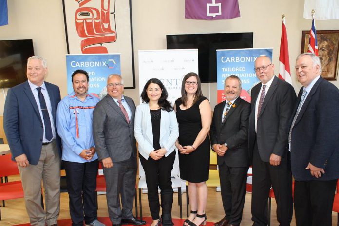 Carbonix president and CEO Paul Pede (third from left) and Peterborough-Kawartha MP Maryam Monsef (fourth from left) at an announcement of $3.1 million in federal funding on July 15, 2019 at Trent University for a clean technology pilot project led by Carbonix Inc., a Canadian indigenous technology company, that aims to use resources more efficiently to reduce pollution and water waste. (Photo: Office of Maryam Monsef)