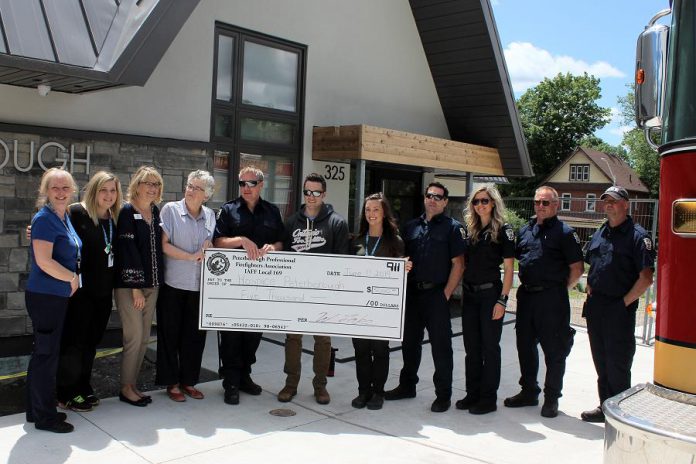 The Peterborough Professional Fire Fighters Association presents a cheque for $5,000 to Hospice Peterborough in June. (Photo courtesy of Hospice Peterborough)