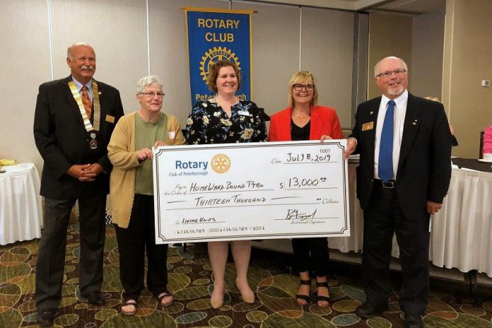 Rotary Club of Peterborough immediate past president Ken Tremblay (left) and Rotarians and auction co-chairs Amy Simpson and Bruce Gravel auction co-chairs (right) present a cheque for $13,000 to Maisie Watson and Lisa Smith from Homeward Bound Peterborough  at the club's July 8, 2019 meeting at the Holiday Inn Peterborough Waterfront. (Photo courtesy of Rotary Club of Peterborough)