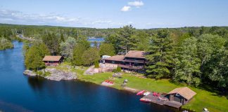The Highlands Cottages, located at 3133 Peterborough County Road 36 in Buckhorn, is a spectacular place to live or to run a business like an Airbnb. The two-acre property on almost 700 feet of waterfront includes a 4,000-square-foot log home, two winterized log cabins, and a boathouse. (Photo: Darryl Griffioen, OneLook Productions)