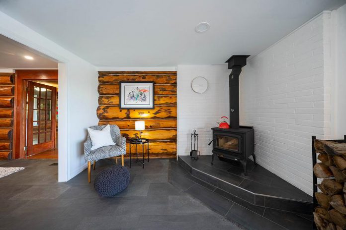 Beautifully built, each building features thick hand-hewn log walls combined with tasteful modern décor. All of the buildings have wood fireplaces. (Photo: Darryl Griffioen, OneLook Productions