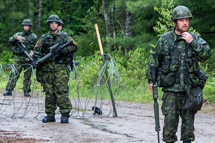 The Ontario Provincial Police and the Canadian Armed Forces are conducting a joint training exercise in the Bancroft area in the evening of July 23, 2019. Pictured is a military training exercise held at Camp Aldershot in Nova Scotia in June 2019. (Photo: Lieutenant (Navy) Sean Costello)