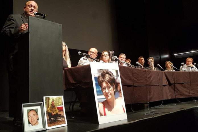 As panel members look on and with photographs of overdose victims displayed on stage, Ontario Associate Minister of Health and Addictions Michael Tibollo speaks at the Opioid Summit on July 11, 2019 at Market Hall Performing Arts Centre in downtown Peterborough. The summit was jointly organized and hosted by Peterborough Mayor Diane Therrien and Selwyn Deputy-Mayor Sherry Senis. (Photo: Office of Michael Tibollo / Twitter)