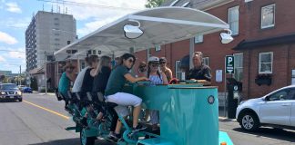 PedalBoro's 15-passenger party bike received a fair share of attention on Tuesday (July 16) during the bike tour company's inaugural downtown tour from The Olde Stone Brewing Company to the Publican House Brewery before heading to Millennium Park. (Photo: Paul Rellinger / kawarthaNOW.com)