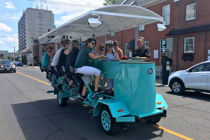 PedalBoro's 15-passenger party bike received a fair share of attention on Tuesday (July 16) during the bike tour company's inaugural downtown tour from The Olde Stone Brewing Company to the Publican House Brewery before heading to Millennium Park. (Photo: Paul Rellinger / kawarthaNOW.com)