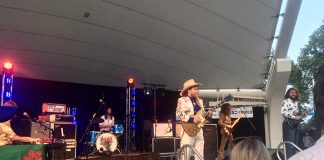 Baileboro native Jimmy Bowskill takes centre stage at The Sheepdogs concert at Peterborough Musicfest in Del Crary Park on July 24, 2019. Eleven people attending the free concert were charged under the City of Peterborough's no-smoking for smoking, vaping, and using cannabis. (Photo: Eva Fisher / kawarthaNOW.com)