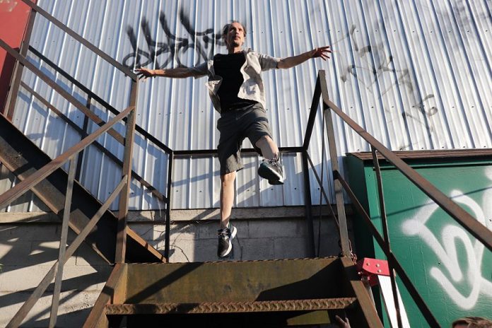 Performance and spoken word artist Wes Ryan will stage "Turtle" on the fire escape behind The Only Cafe in downtown Peterborough for three 10-minute performances on July 27 and 28, 2019. The pop-up performances, which also features music by Fire Flower Revue and photography by Jessica Lynn Scott, explore themes of safety, disability, and accessibility, along with pushing personal boundaries and being in places you are not expected -- like a turtle crossing the highway. The performances will raise funds for the Ontario Turtle Conservation Centre. (Photo: Jessica Lynn Scott)