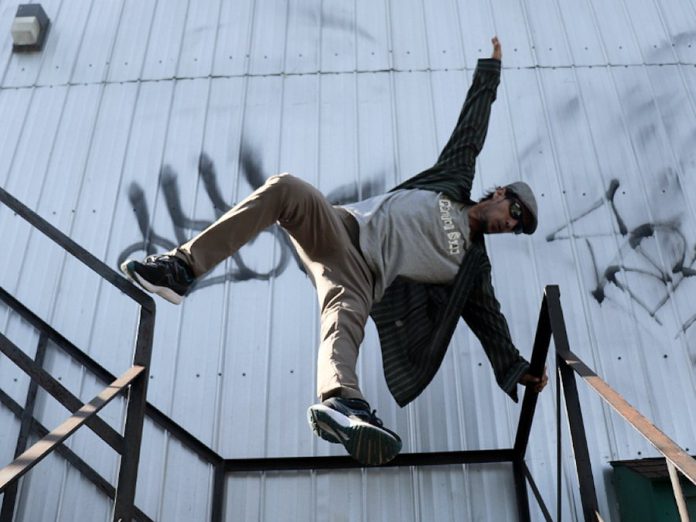 Reflecting recent losses in Peterborough's arts community, "Turtle" is also about the potential for danger (like turtles crossing a road) that people face in their everyday lives. Wes Ryan, who is a brain injury survivor who is performing on a fire escape, has rehearsed meticulously to ensure he is safe.  (Photo: Jessica Lynn Scott)