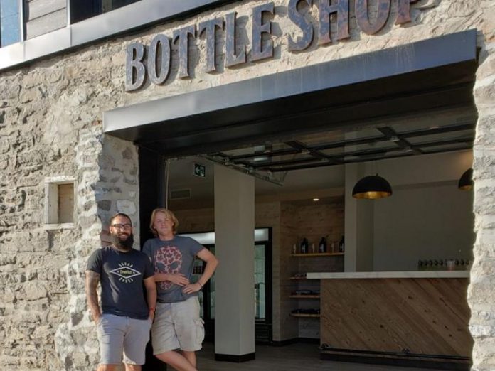 Fenelon Falls Brewing Co. general manager Mathew Renda and head brewer Russell Gibson at the brewery's new Bottle Shop, which officially opened on August 24, 2019 and sold out within hours. (Photo courtesy of Fenelon Falls Brewing Co.)