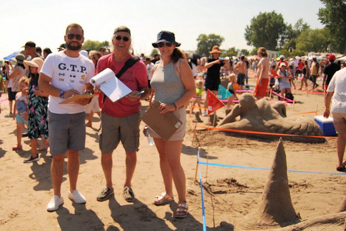 Judges for the amateur sandcastle building competition were Northumberland-Peterborough South MPP David Piccini, Snapd Northumberland co-owner Fred Gouveia, and local photographer Gillian Smith-Clark. (Photo: April Potter / kawarthaNOW.com)